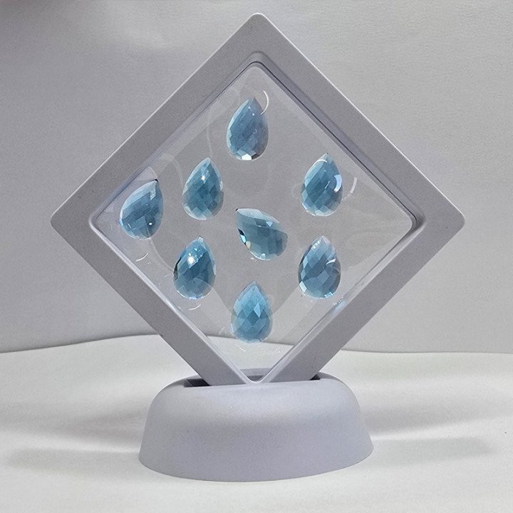 Lot with 7 Blue Topazes, Pear Cut 10x15 mm - 60.53 ct