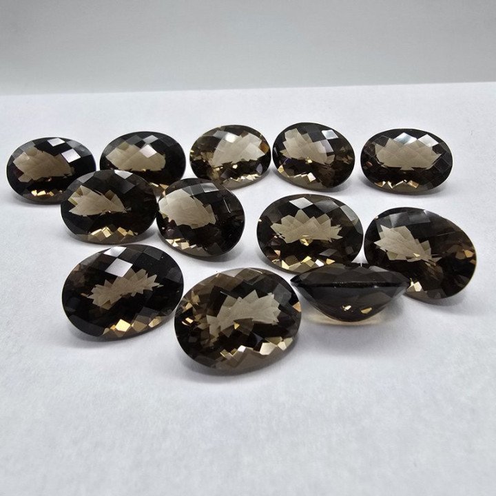 Lot of 12 Oval-Cut Smoky Quartzs 12 x 16 mm - 95.96 ct